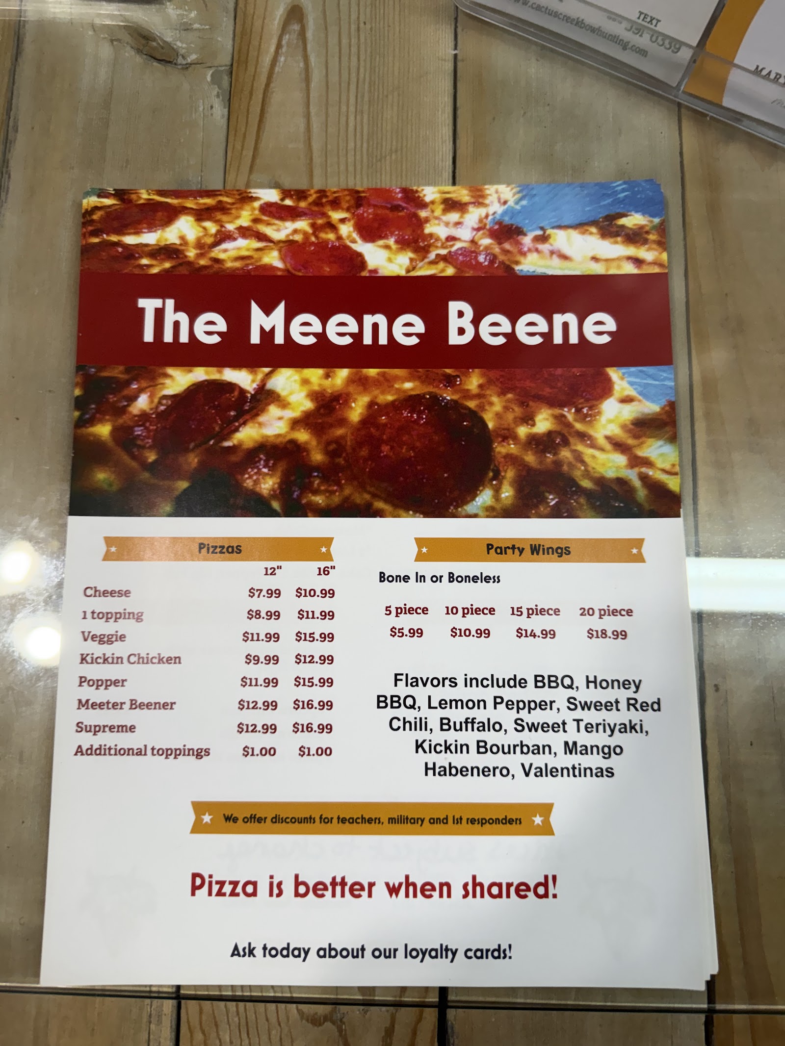 The Meene Beene pizza and wings menu board